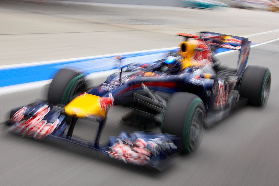 Sebastian Vettel, Red Bull Racing, rushes through pitlane