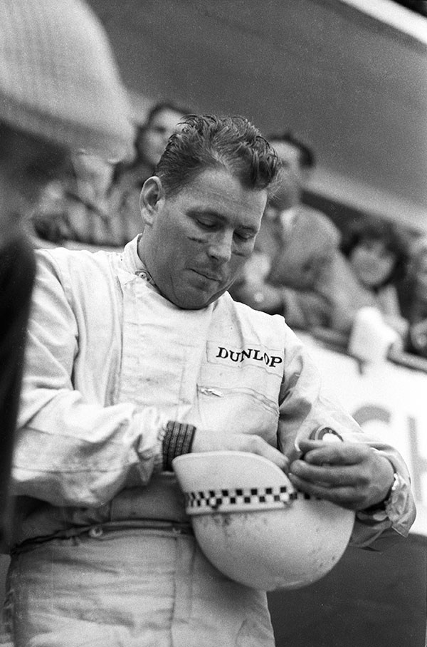 Herbert Linge adjusting his helmet