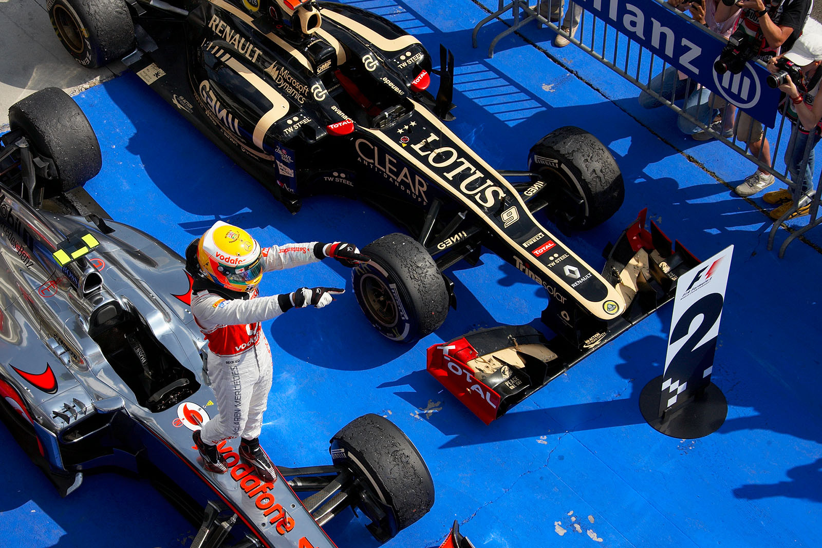 Race winner Lewis Hamilton of McLaren celebrates his achivement on his race car in parc ferme