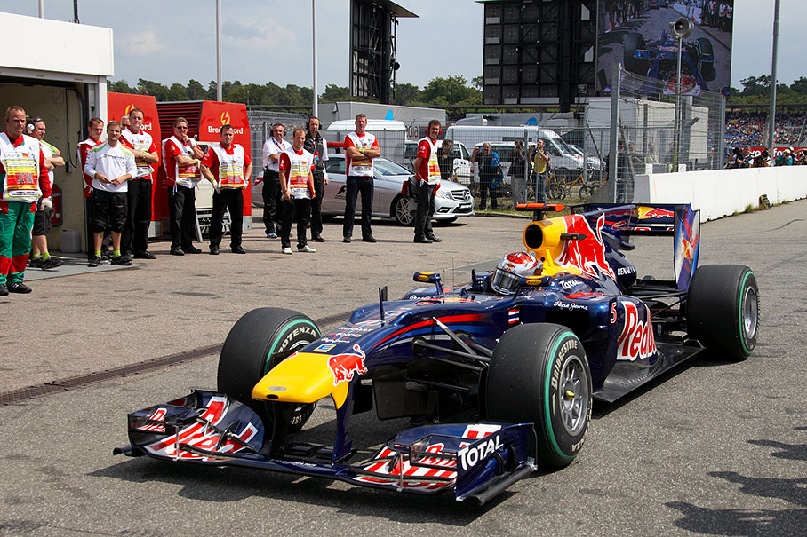 Sebastian Vettel, Red Bull Racing, rolls towards parc ferme after setting pole position