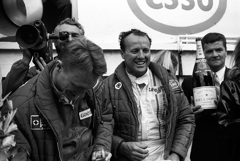 Winning team Dan Gurney (USA) and A. J. Foyt (USA) celebrate with champagne on podium