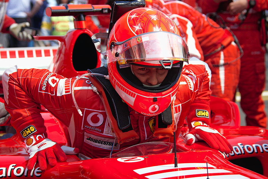 Michael Schumacher rising from his seat after positioning his car at second grid place