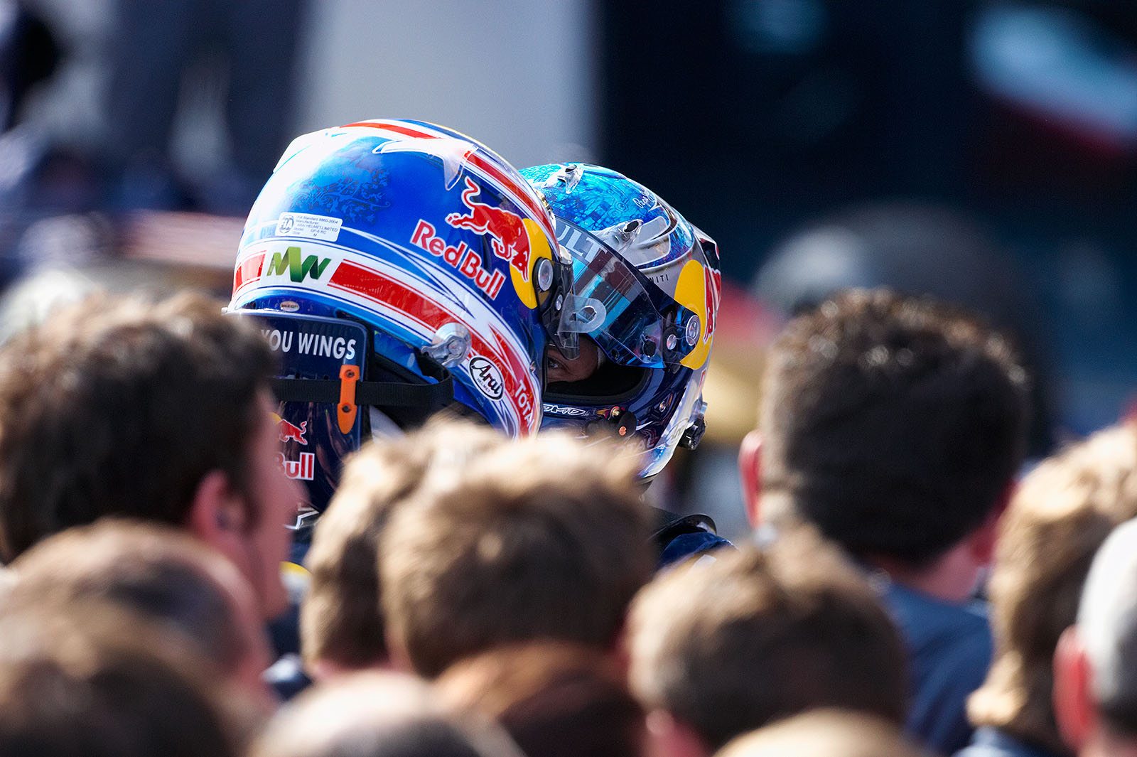The winner of the Turkish GP, Red Bull's Sebastian Vettel, talks to his team mate Mark Webber after the race in parc ferme