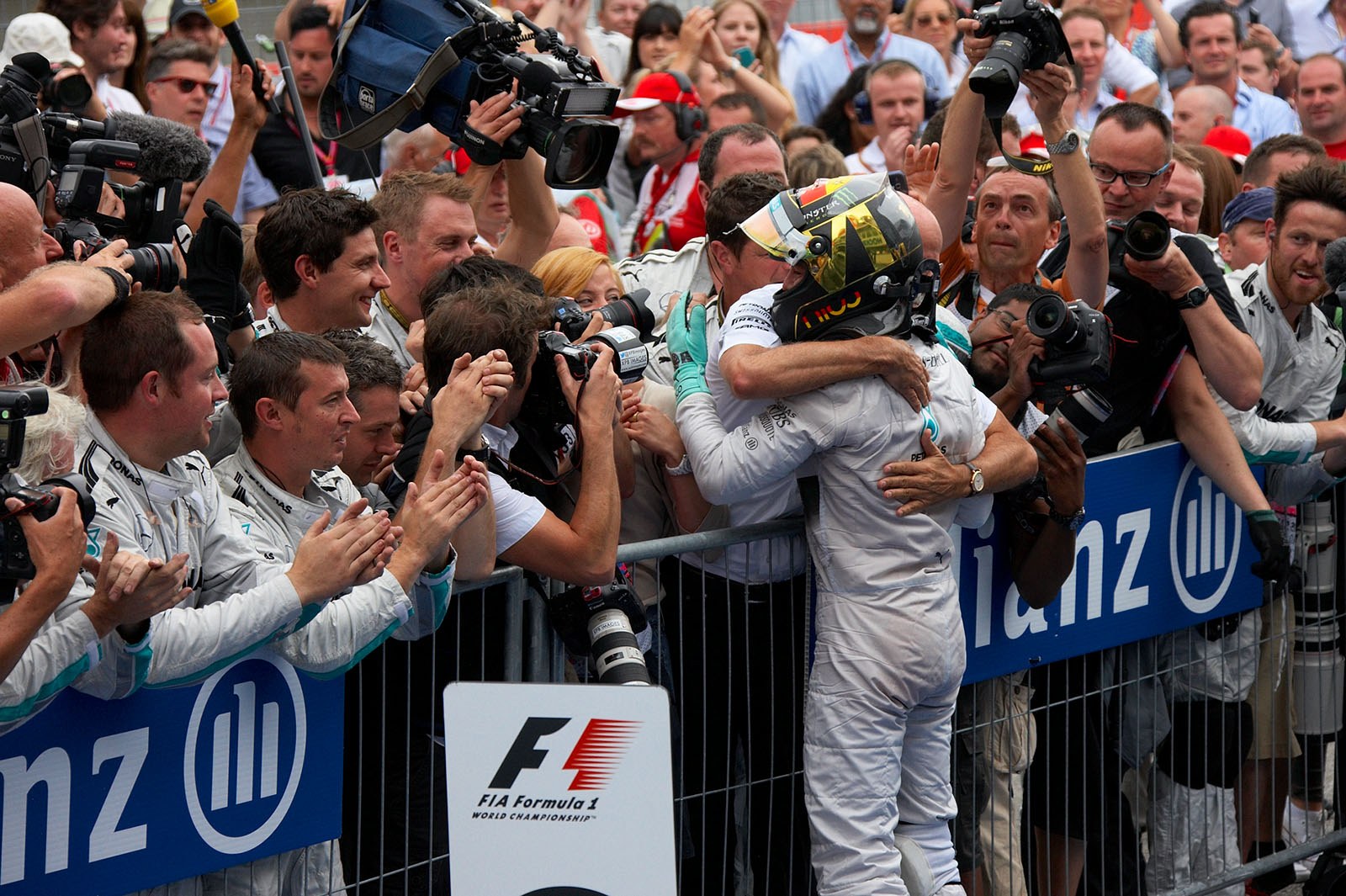 Hugged by the prowed Mercedes CEO Dieter Zetsche: Nico Rosberg, winner of the German Grand Prix, Hockenheim, 2014