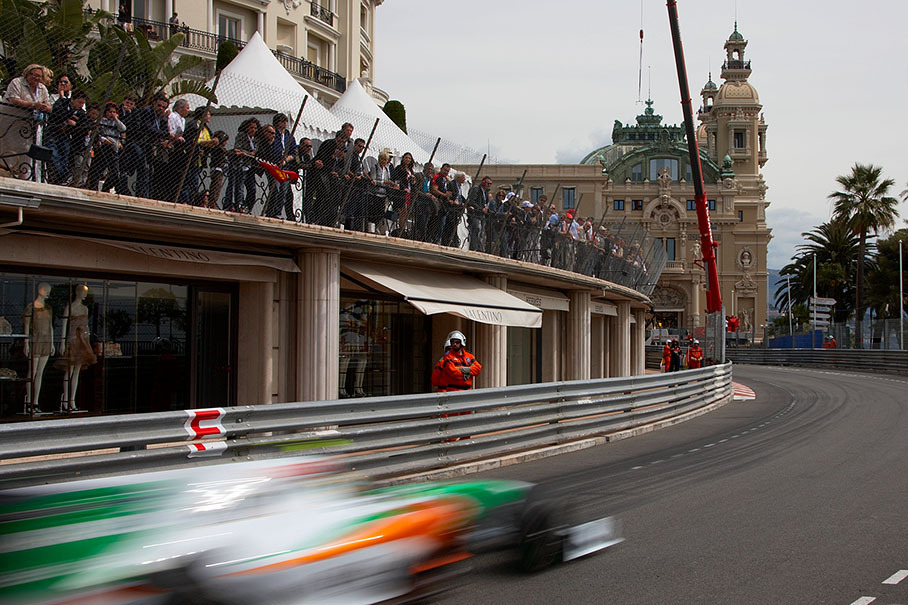 A Force India-Ferrari passes the shops before the casino