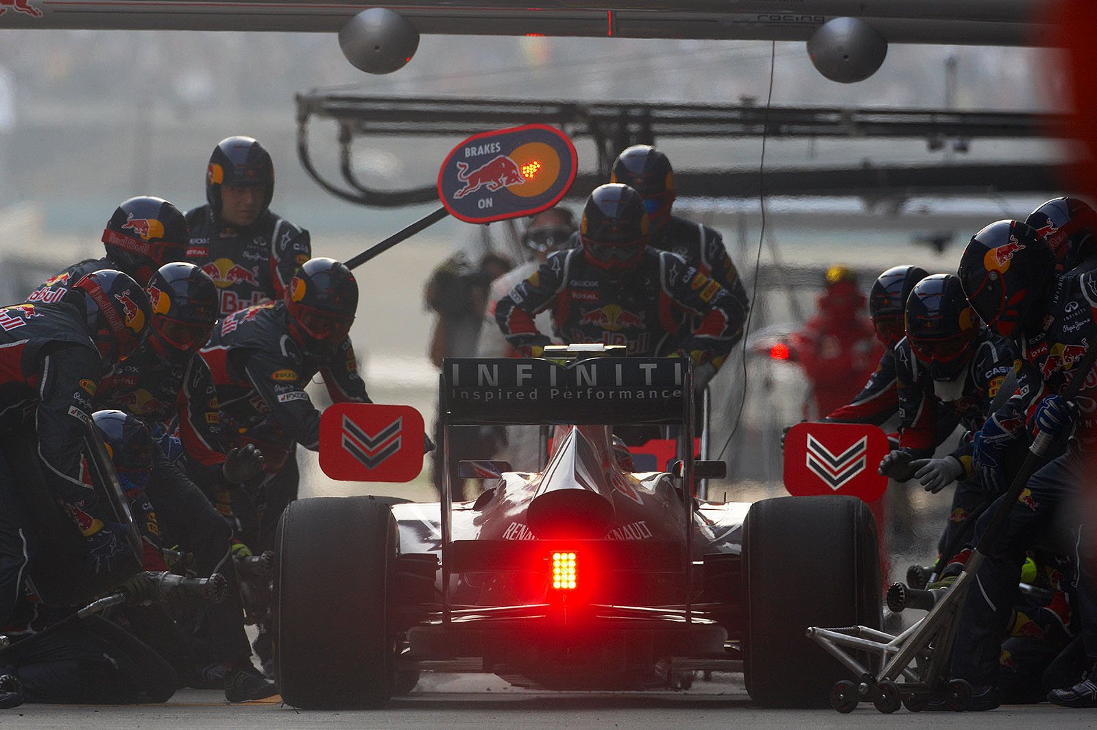 Mark Webber enters the Red Bull Racing pits for a service