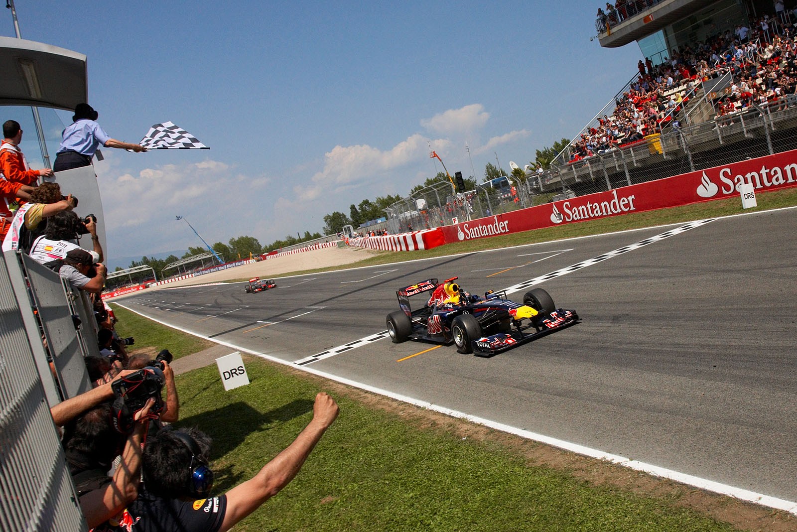 Sebastian Vettel crosses the finish line to take yet another victory.
