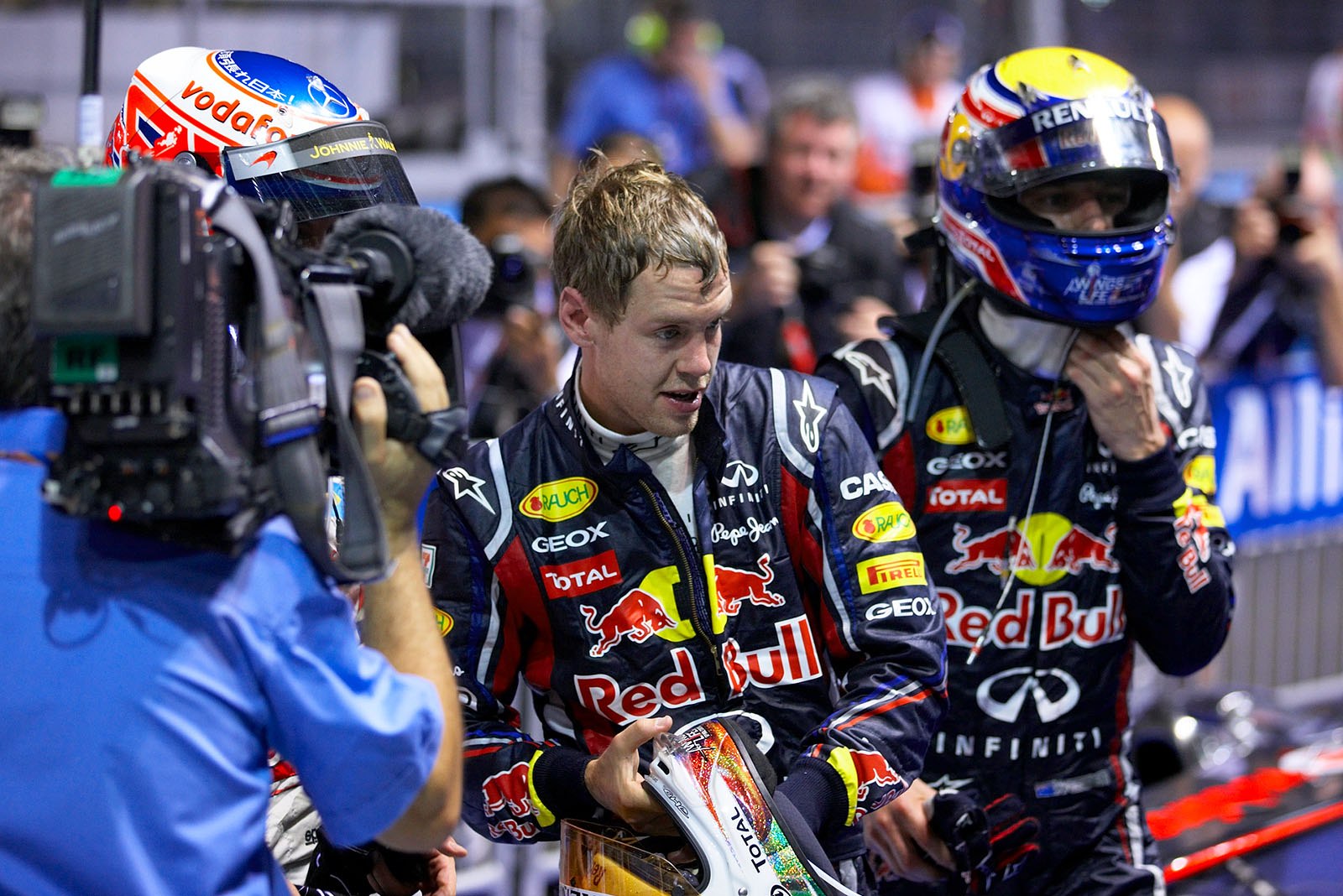 Race winner Sebastian Vettel, Red Bull Racing, with his team mate Mark Webber and Jenson Button after the race in parc ferme