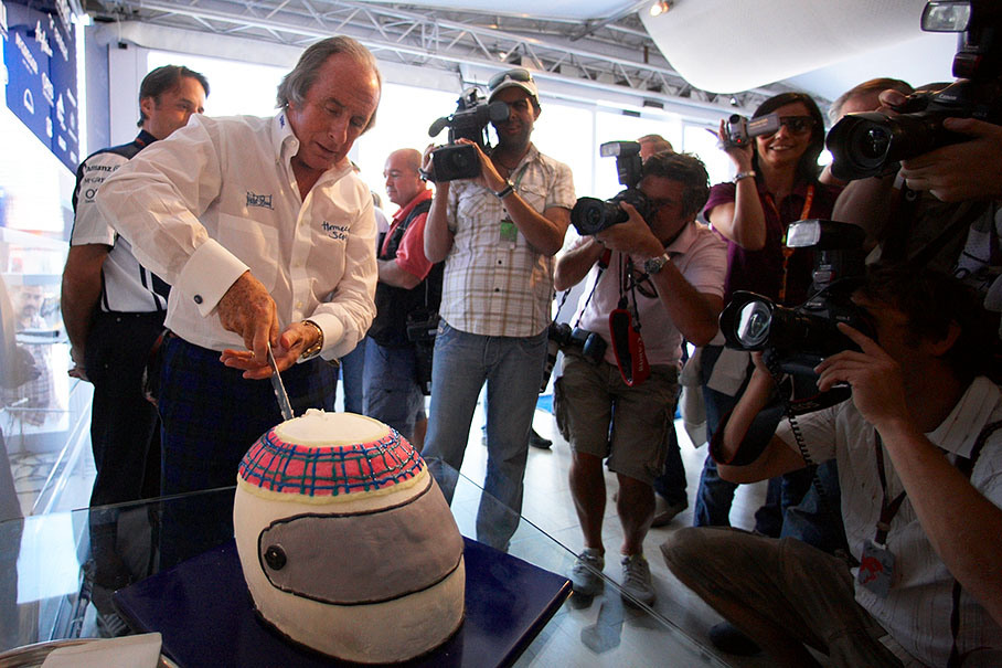 Sir Jackie Stewart celebrates the 40th anniversary of winning the 1969 Italian Grand Prix at Monza with a large cake for the hungry press which he received from the Williams team