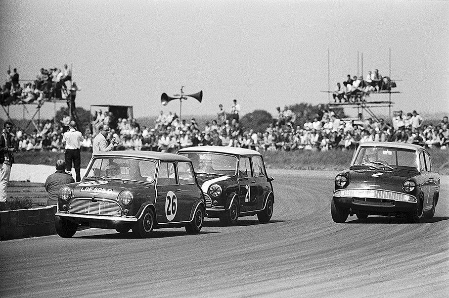 Winner of the 1300cc class Steve Neal (Equipe Arden Austin Mini Cooper S, #26, 8th overall) in front of second placed John Rhodes, British Saloon Car Championship, Silverstone 1967