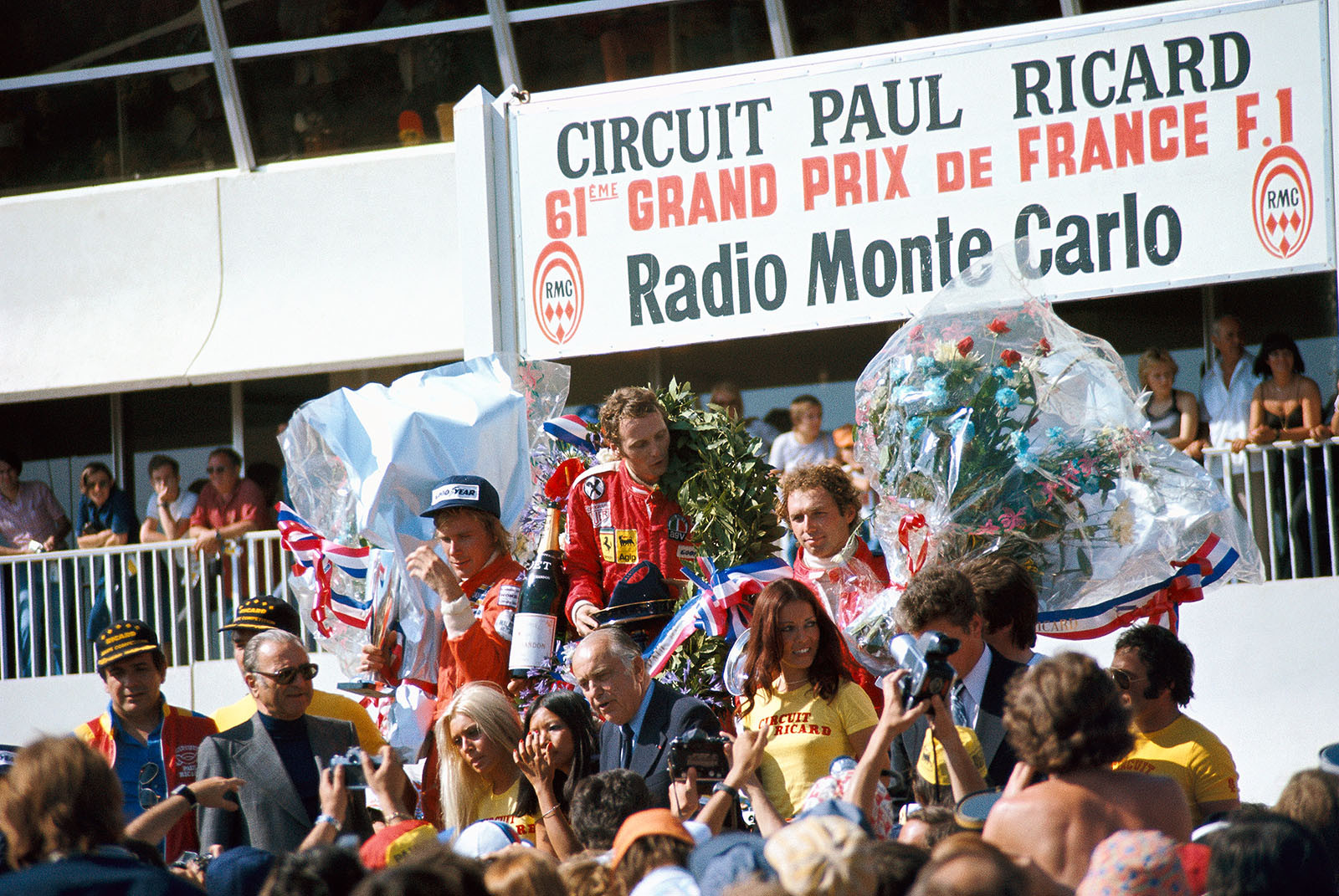 Podium group photo after the ceremony: Second placed James Hunt of Hesketh, Ferrari's race winner Niki Lauda and third placed Jochen Mass, McLaren