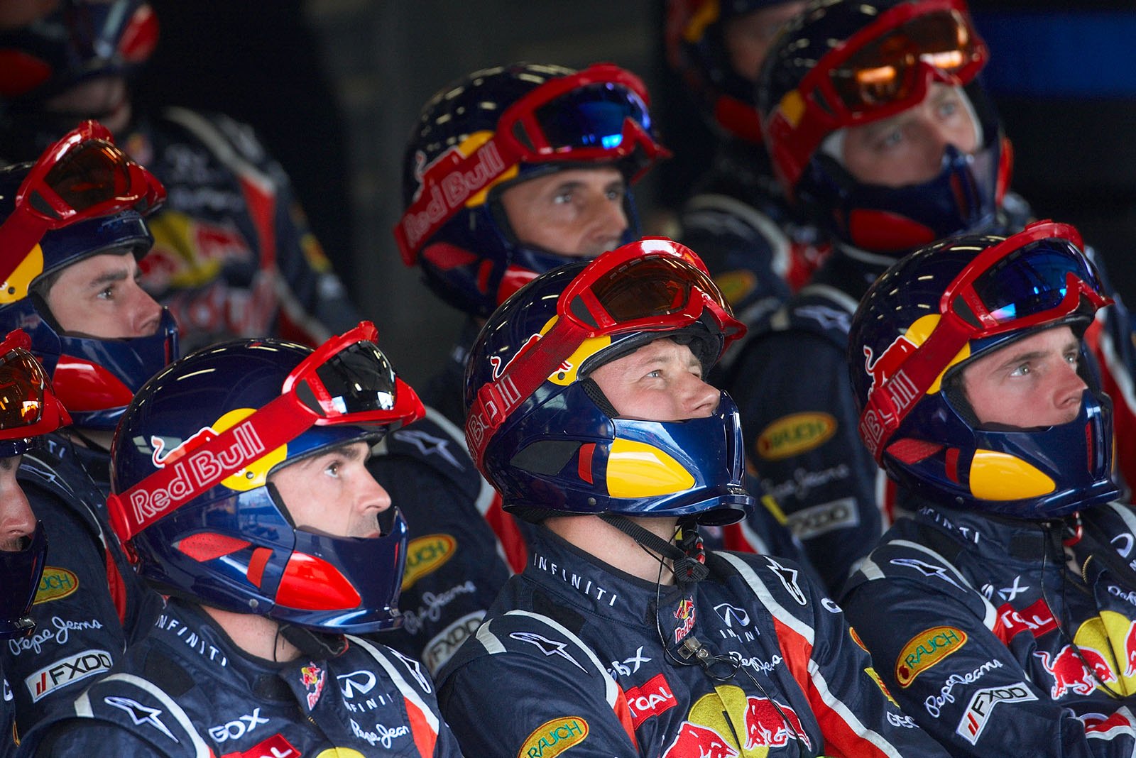 The Red Bull pit crew watches the race on a screen