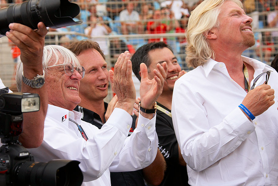 Bernie Ecclestone, Christian Horner of Red Bull and Virgin's Richard Branson applaude for Hungarian artist David Merlini who just broke his own world record for holding breath underwater