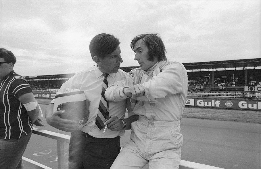 Jackie Stewart chats with team principal Ken Tyrrell before the 1969 British GP