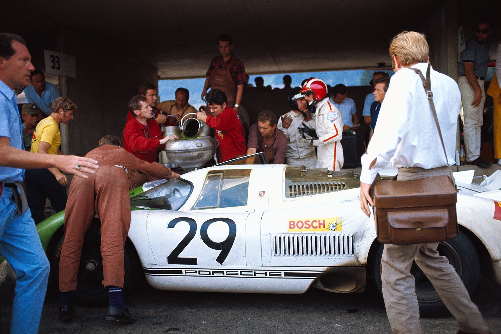 The winning Porsche 917 009 with Jo Siffert (CH) and Kurt Ahrens, Jr. (D) in pits