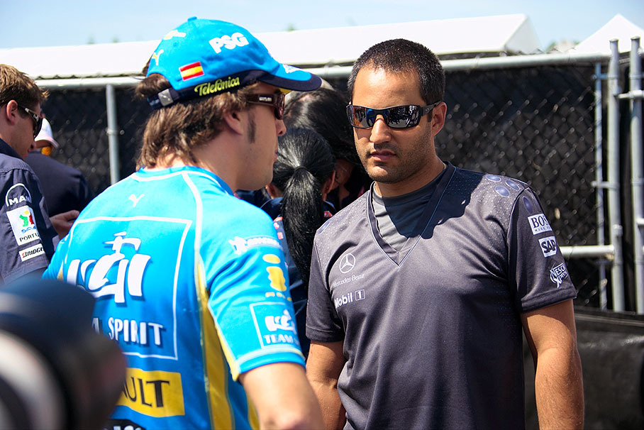 Juan Pablo Montoya chats with Fernando Alonso