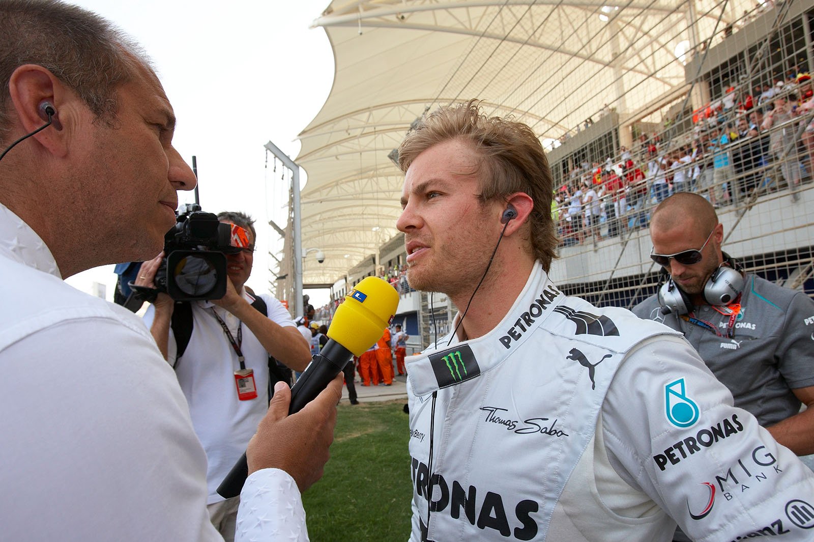 Pole sitter Nico Rosberg of Mercedes gives an interview on the grid