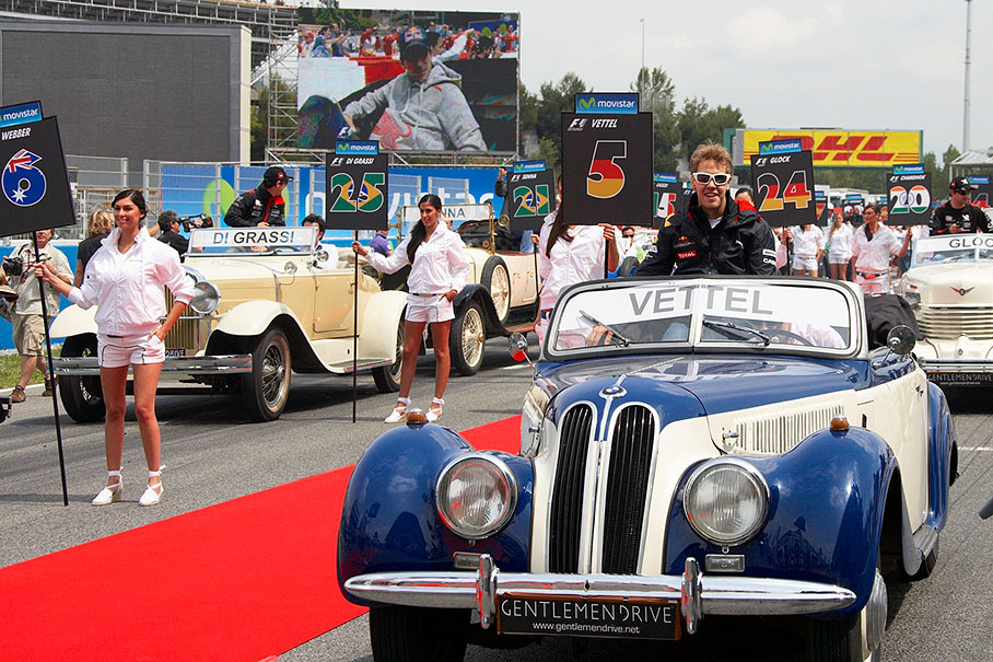 Sebastian Vettel enjoys a ride in a historic BMW car
