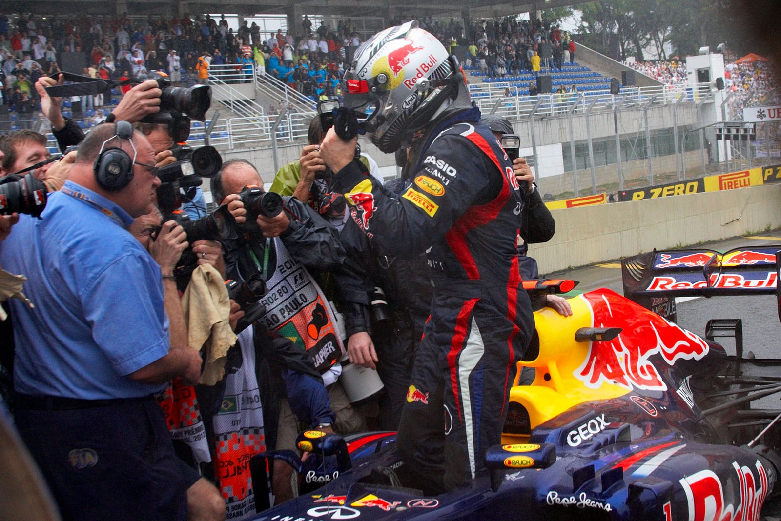 Sebastian Vettel, Red Bull Racing, stands up in his race car in parc ferme as sixth placed and becomes the youngest triple F1 World Champion ever!