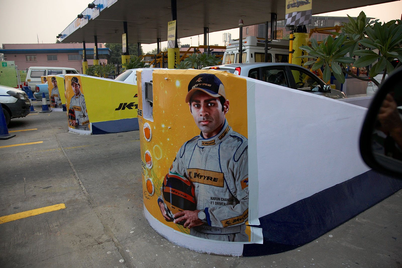 Karun Chandhok's portrait welcomes the tourists and car drivers at the motorway paypoint