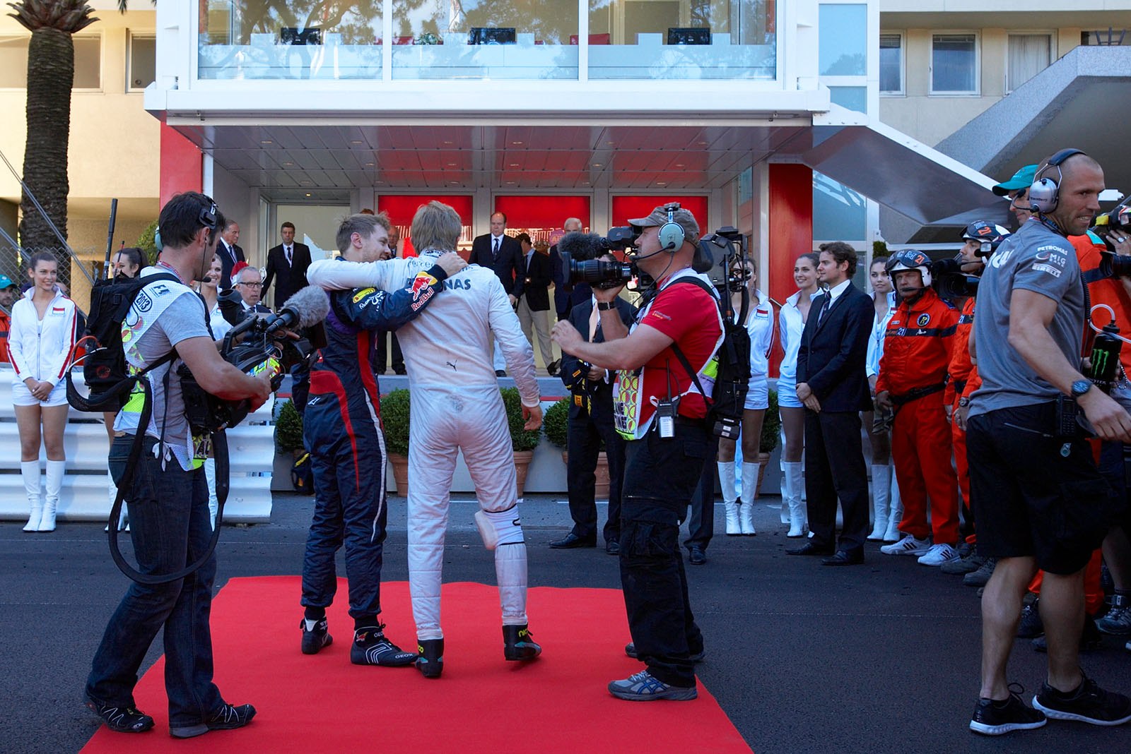 Second placed Sebastian Vettel congratulates race winner Nico Rosberg of Mercedes in parc ferme