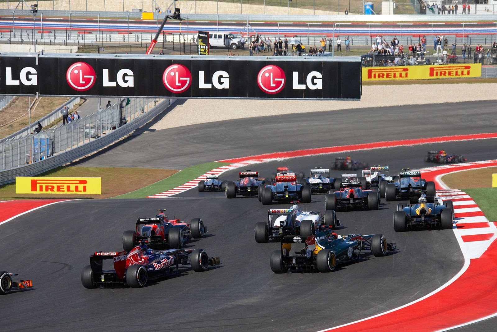 At the start, Sebastian Vettel of Red Bull Racing leads in front of team mate Webber and McLaren's Hamilton