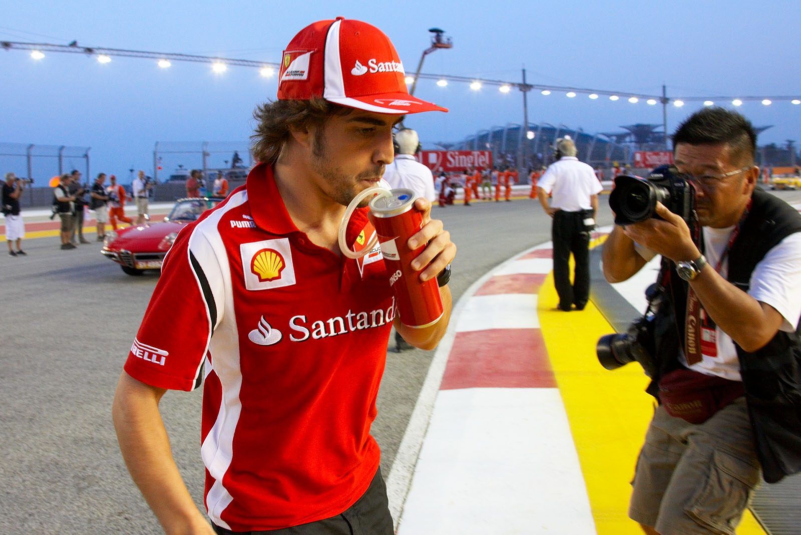 Fernando Alonso of Ferrari returns from drivers parade
