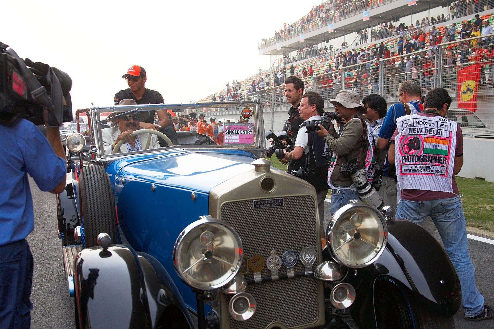 Lewis Hamilton looks forward to his parade lap in a historic car