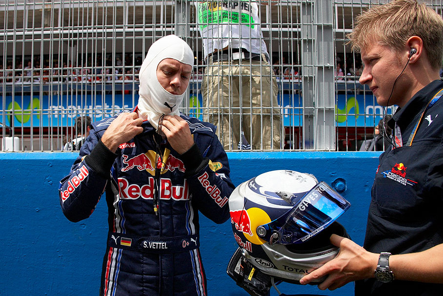 Sebastian Vettel prepares for the race with the help of his physio Tommi Parmakoski