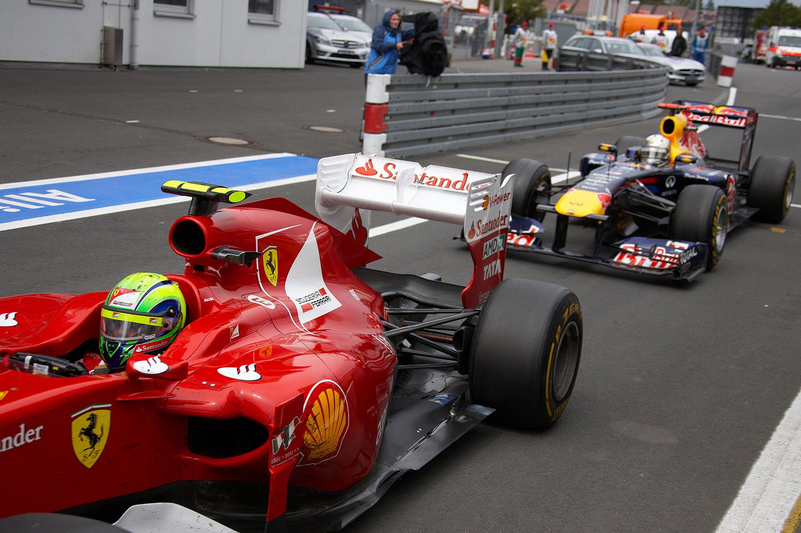 Felipe Massa, Ferrari, enters pit lane in front of Vettel on the penultimate lap