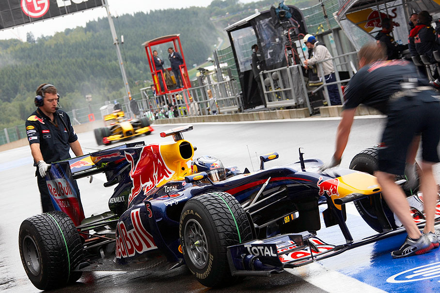 Sebastian Vettel comes to Red Bull pits during a rainy practice