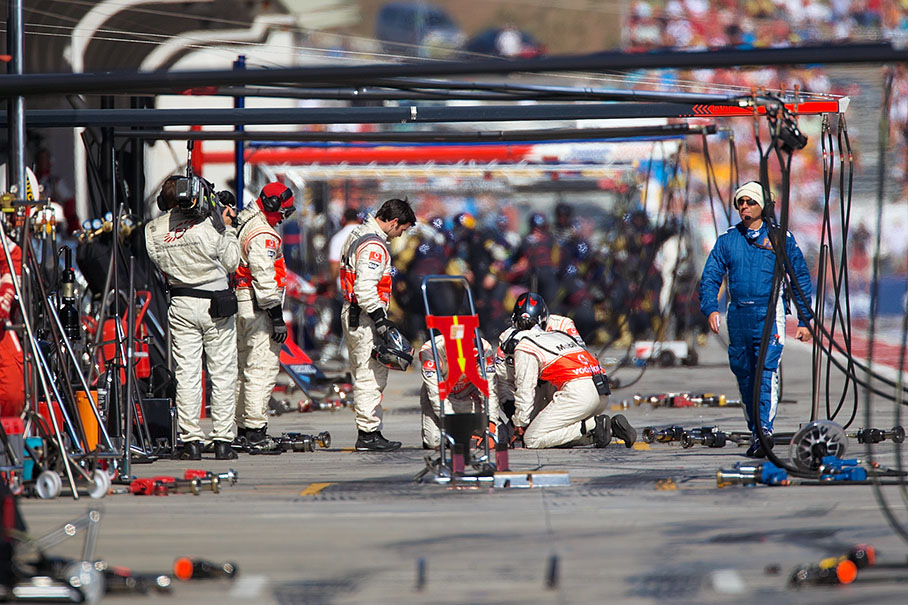 McLaren Mercedes pit crew prepares for a pit stop