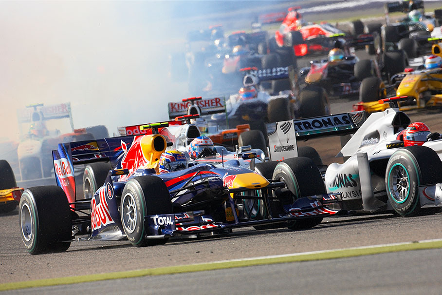 Mark Webber's Red Bull Racing Renault burns some spilled oil during the start, without effect on its performance