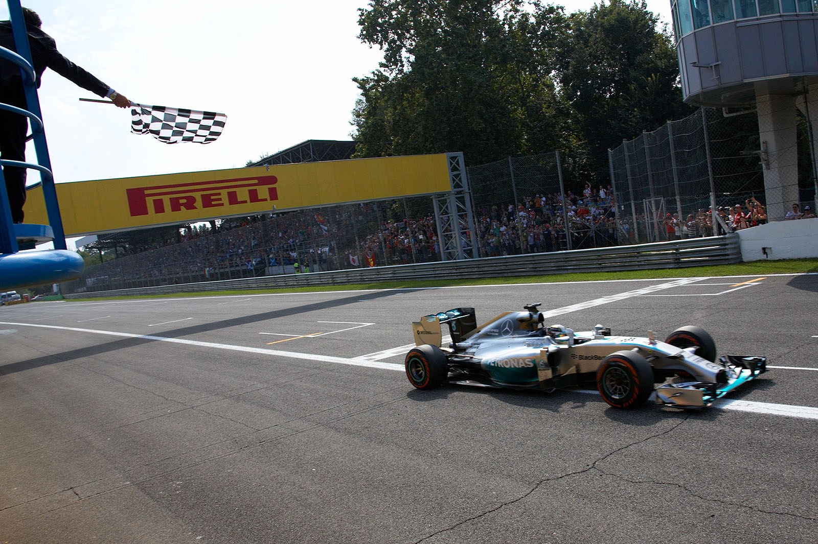 Lewis Hamilton, Mercedes, has crossed the finish line to win the Italian Grand Prix, Monza, 2014