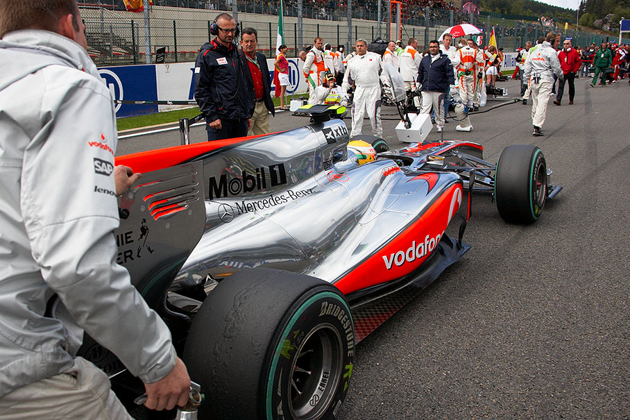Lewis Hamilton, McLaren Mercedes, is pushed across the grid