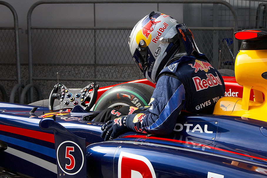 Polesetter Sebastian Vettel exits his Red Bull-Renault in parc ferme after Q3