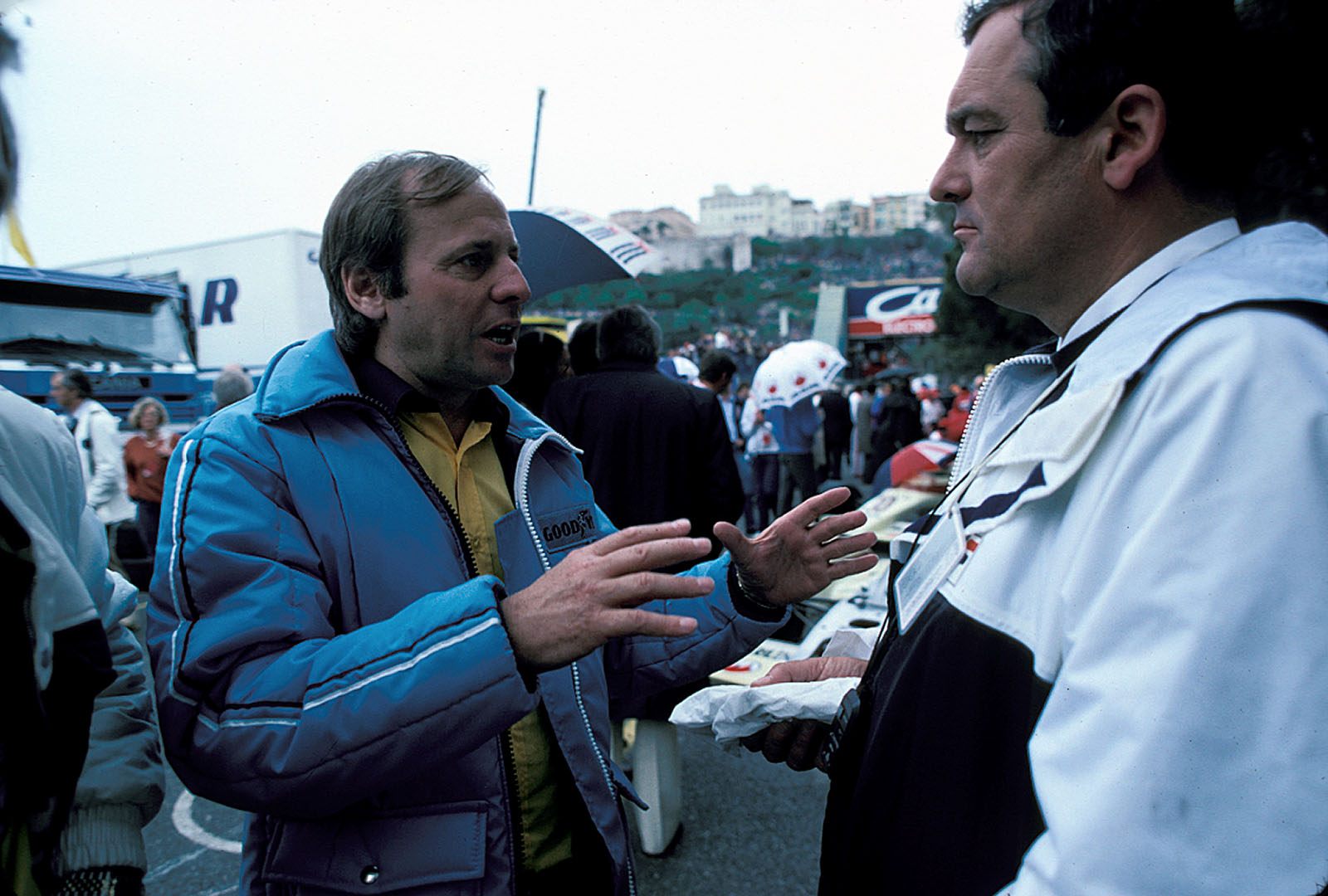 Guenter Schmidt, ATS team boss, talks with BMW technical director Paul Rosche