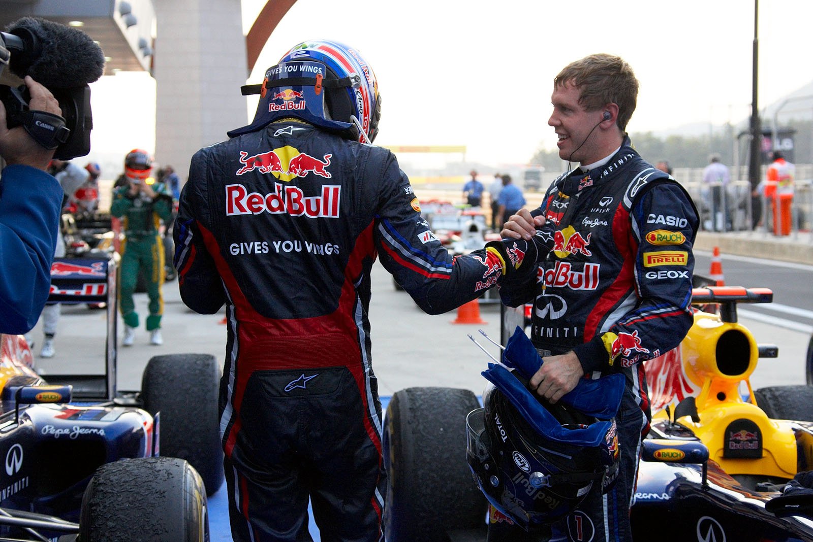 Red Bull Racing's Webber and Vettel congratulate each other in parc ferme after the Korean GP