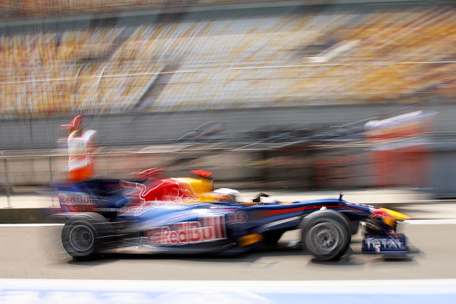 Sebastian Vettel, Red Bull Racing, zooms through pitlane