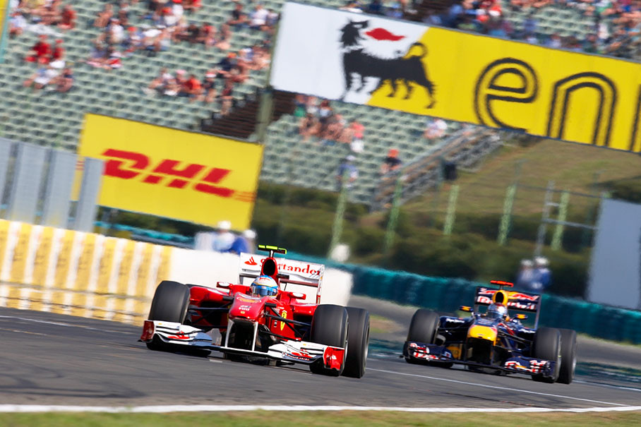 Second positioned Fernando Alonso, Ferrari, leads Red Bull's Vettel