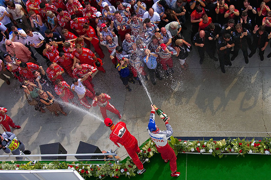 Michael Schumacher (left) and his brother Ralf on the podium.