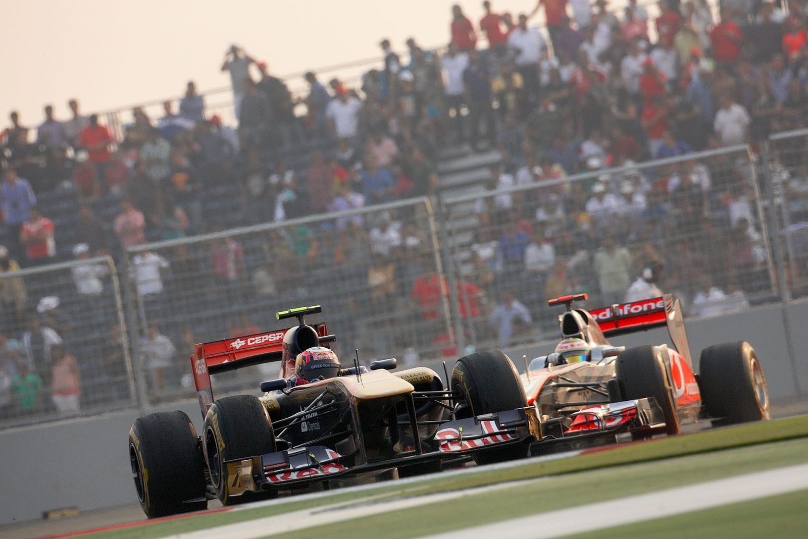 Jaime Alguersuari, Toro Rosso, in front of McLaren's Hamilton
