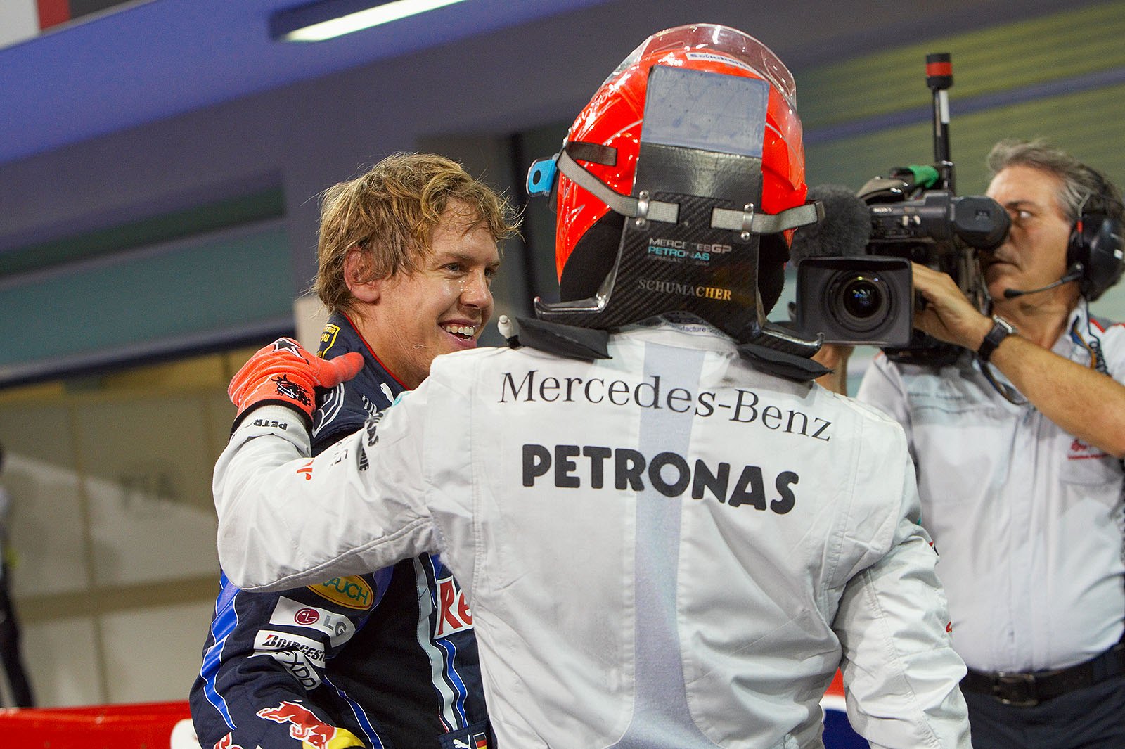 Michael Schumacher, Mercedes GP, congratulates polesitter Sebastian Vettel of Red Bull Racing after qualifying