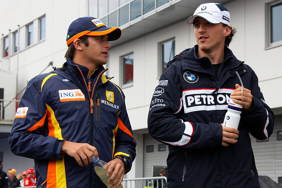 Nelson Piquet jr. and Robert Kubica walk to drivers parade