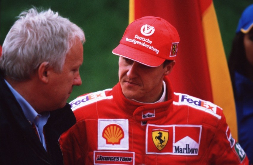 Michael Schumacher in serious discussion with FIA race director Charlie Whiting