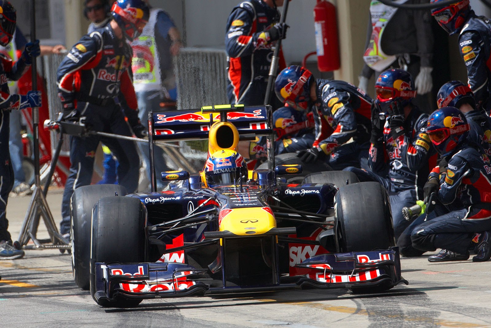 Mark Webber ends his stop at Red Bull Racing pits