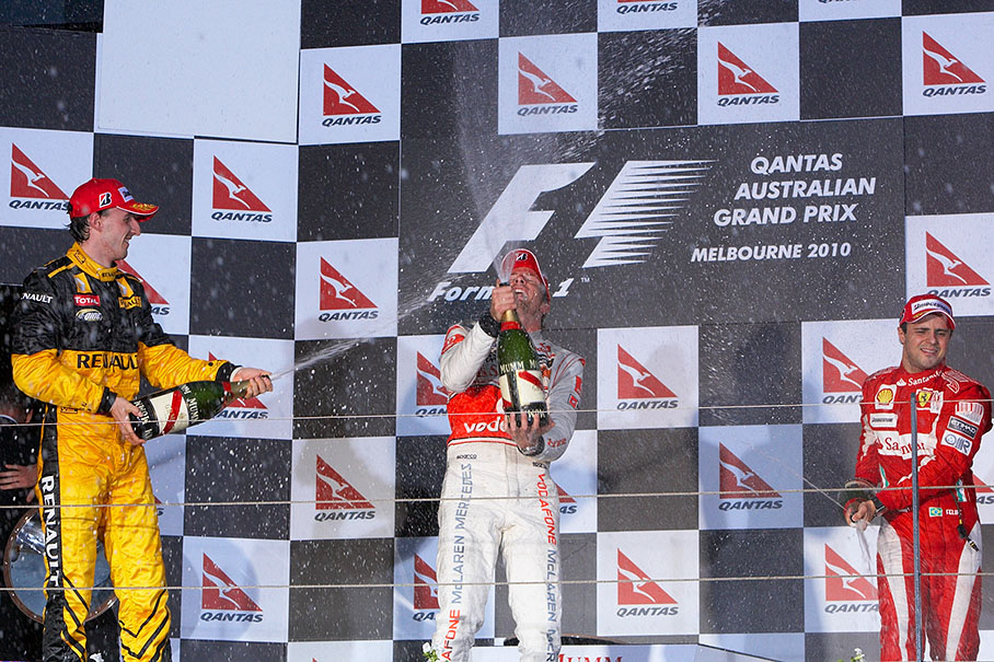 Second placed Robert Kubica, winner Jenson Button and third positioned Felipe Massa spray champagne after the podium ceremony