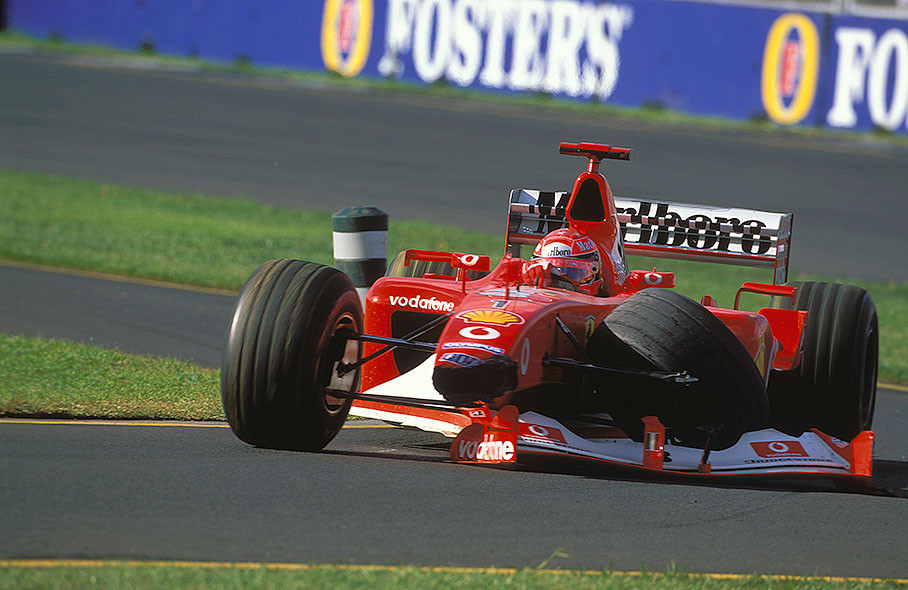 Michael Schumacher bringing his crashed car home on three wheels, losing front wing and wheel