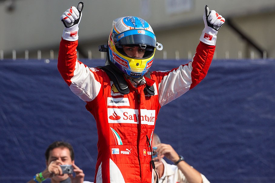 Race winner Fernando Alonso celebrates in parc ferme