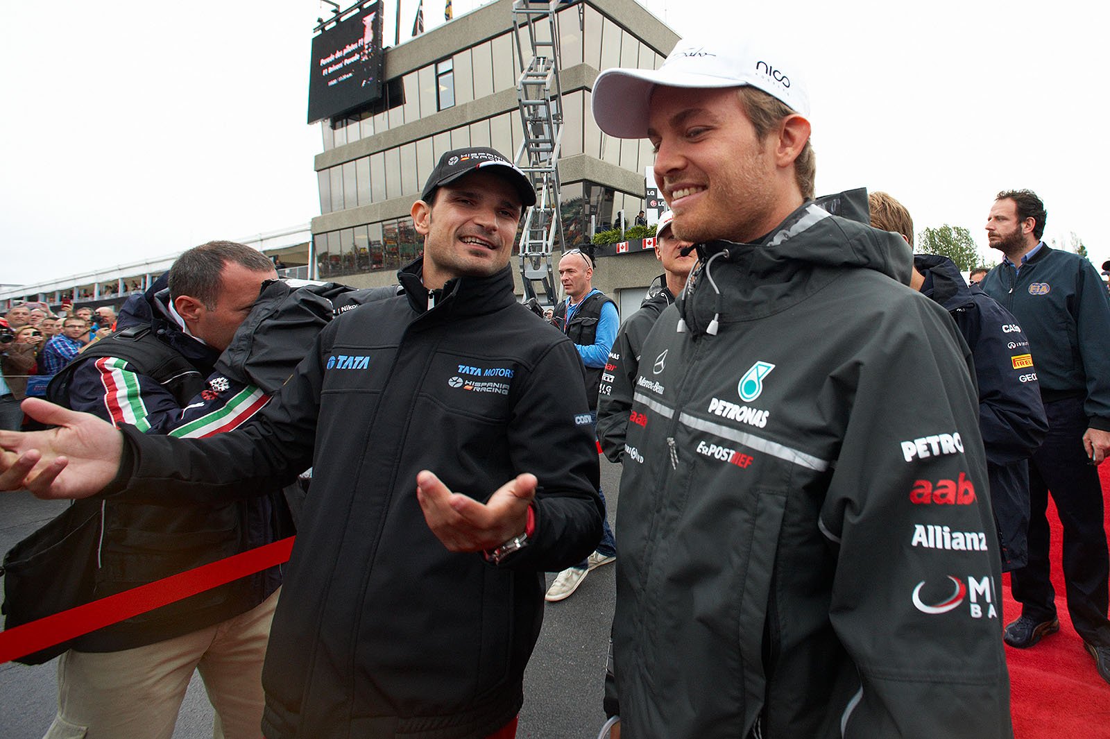 Vitantonio Liuzzi gesticulates at Nico Rosberg before drivers parade